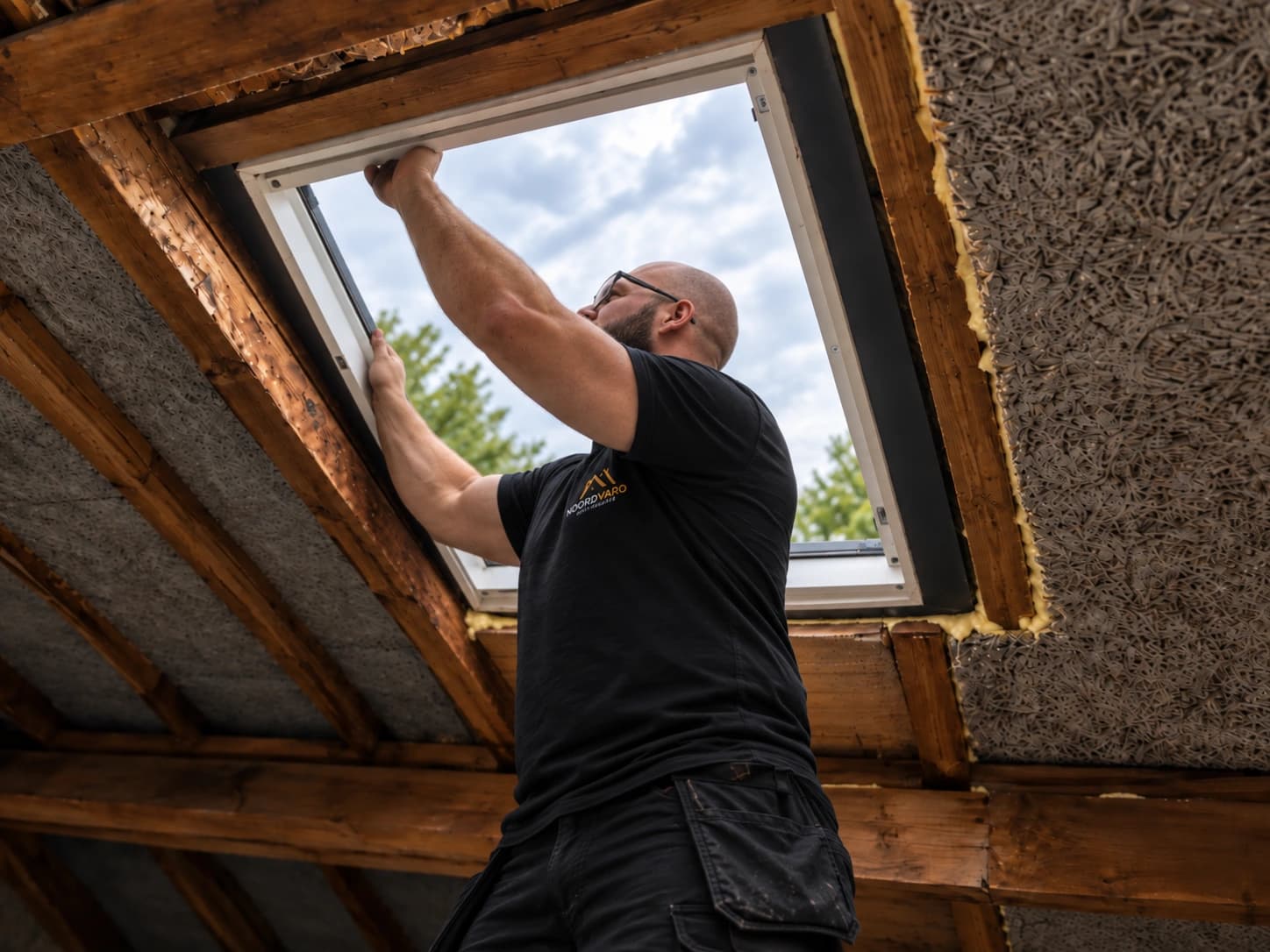 Roof window installation viewed from inside an attic.
